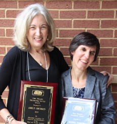 Adele and Kendra smiling with awards